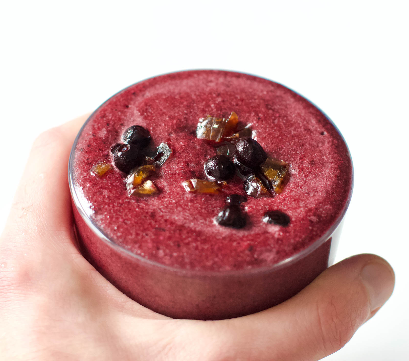 One serving of Simple Cacao-Berries Smoothie presented in hand