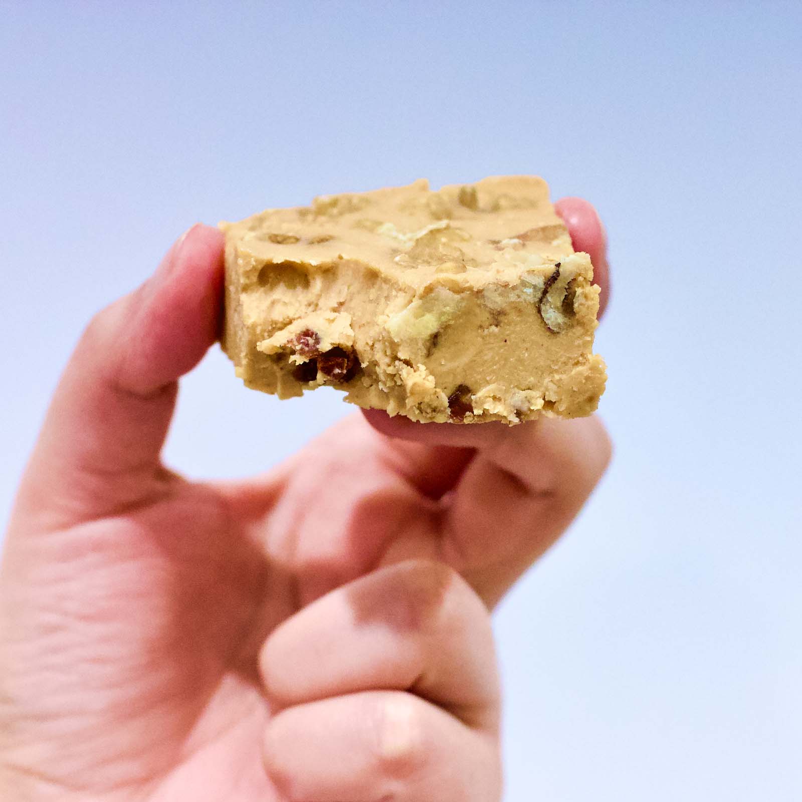 One serving of Delicious Cashew Butter Fat Bomb cookie bitten in, close-up