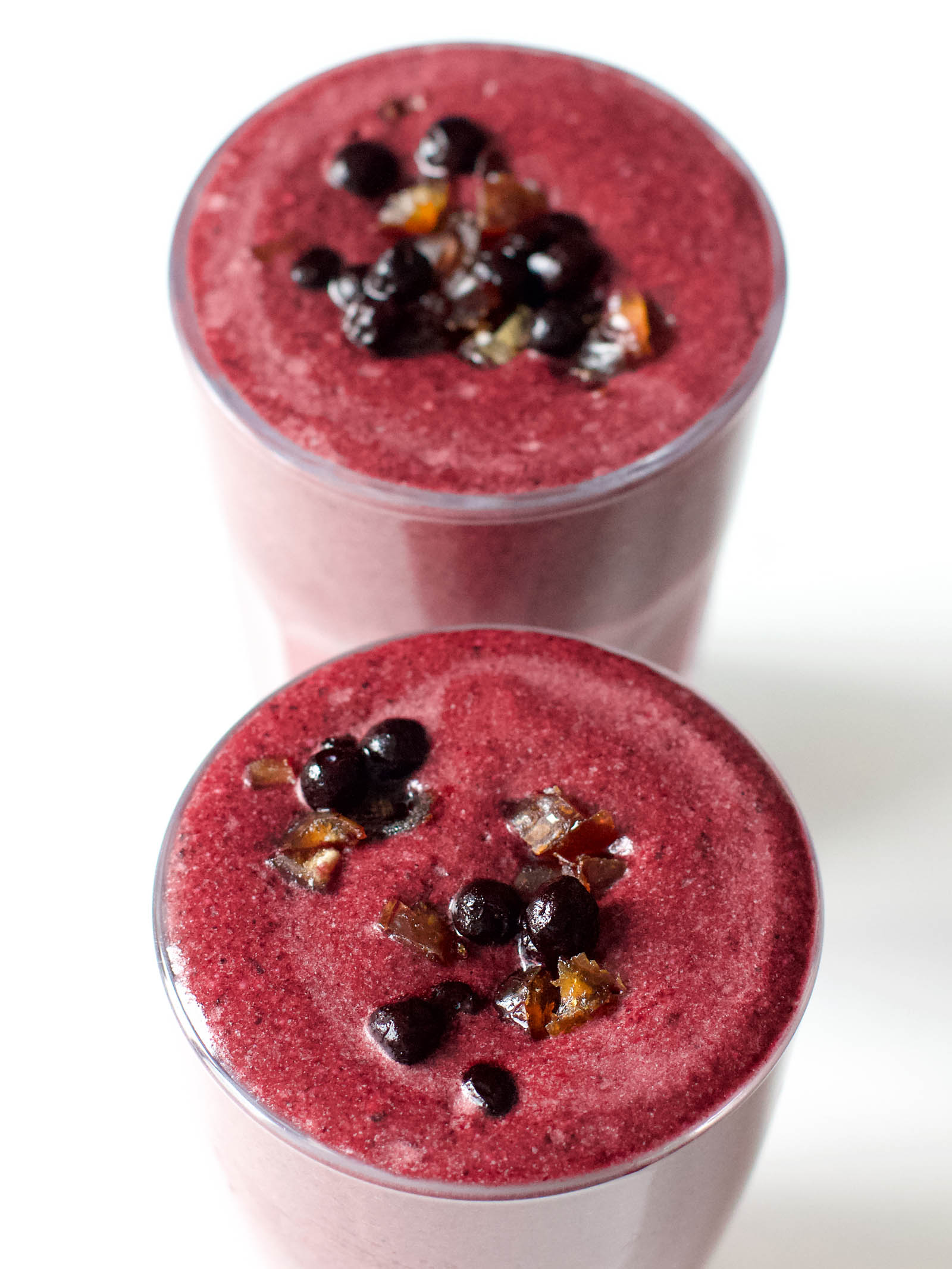 Two servings of Simple Cacao-Berries Smoothie on a white table