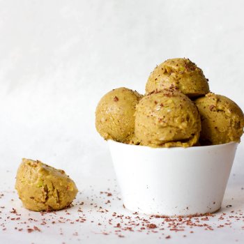 Big serving of Vegan Sweet Peach Ice Cream topped with grated dark chocolate.