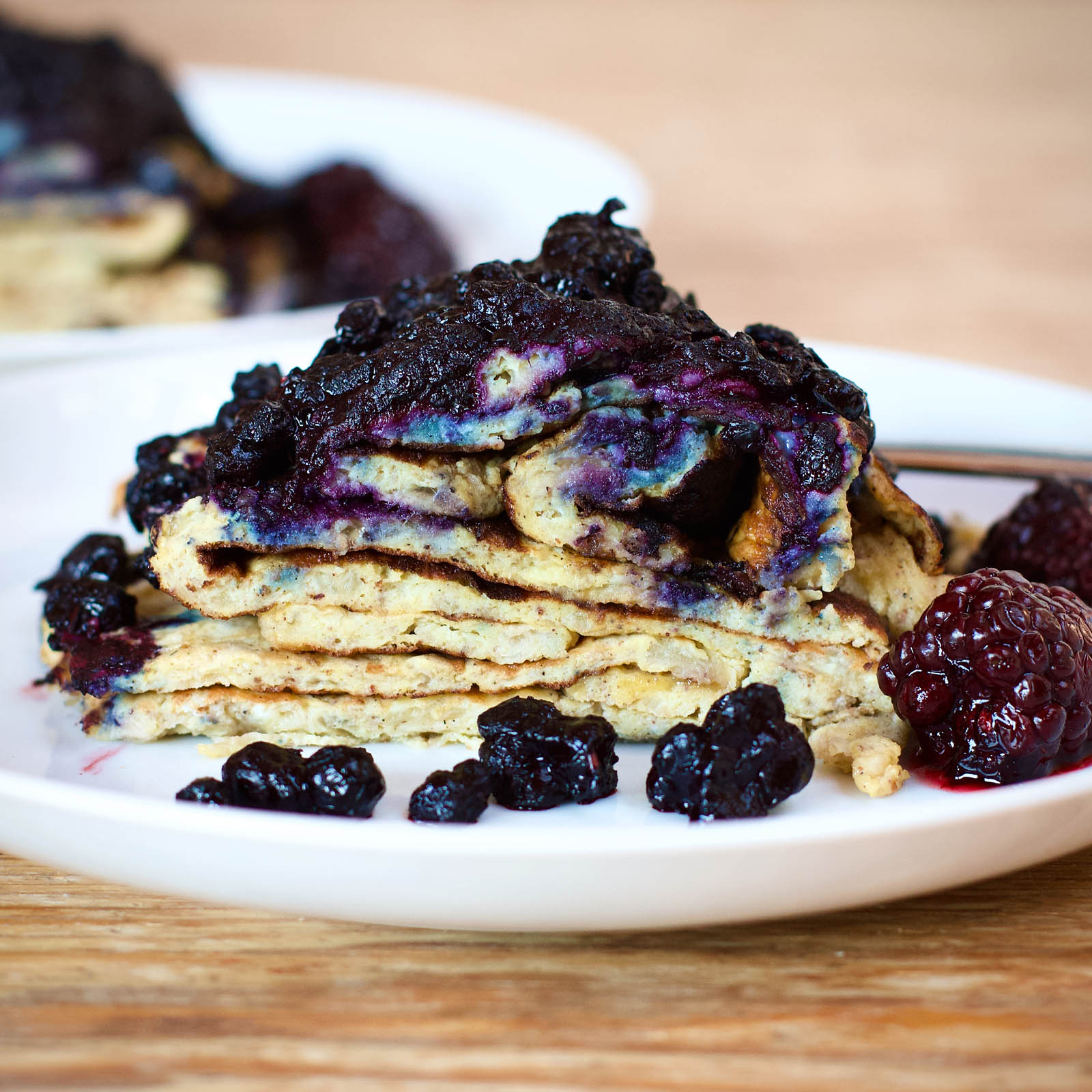 Serving of Messy Banana and Egg Pancakes in white plate, close-up