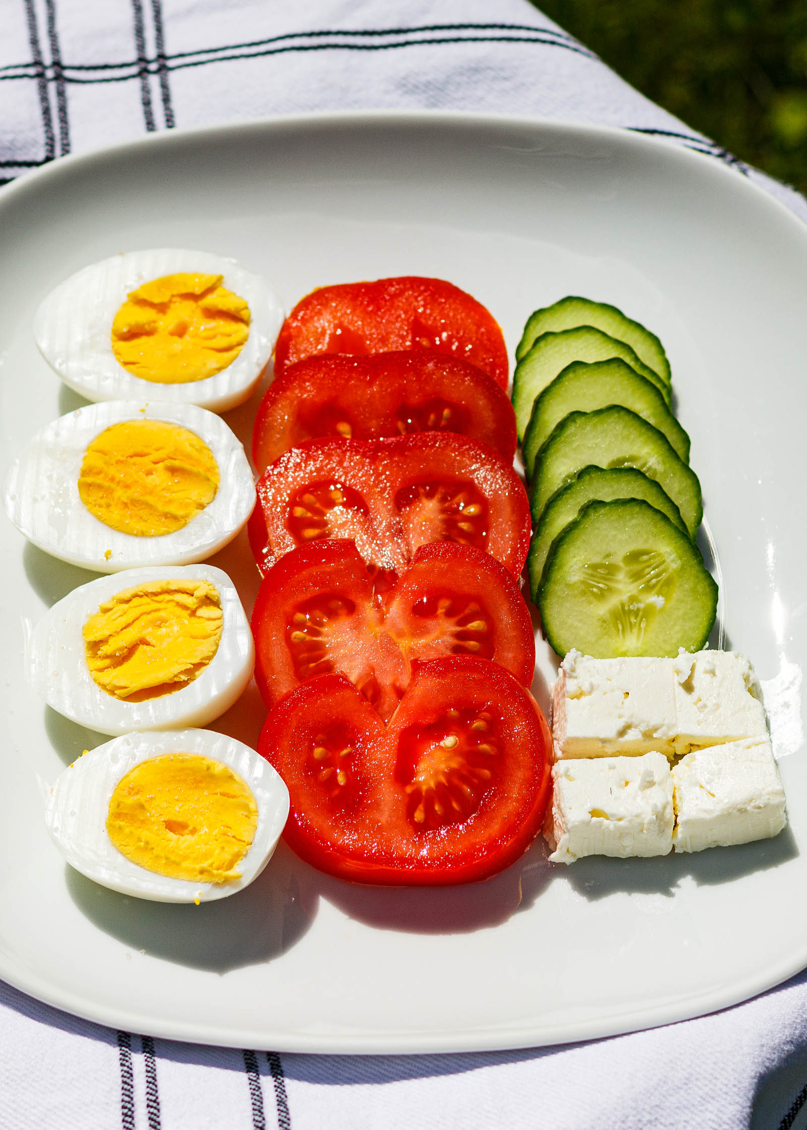 Close-up shot of white plate with a serving of Vegetarian Keto Summer Breakfast