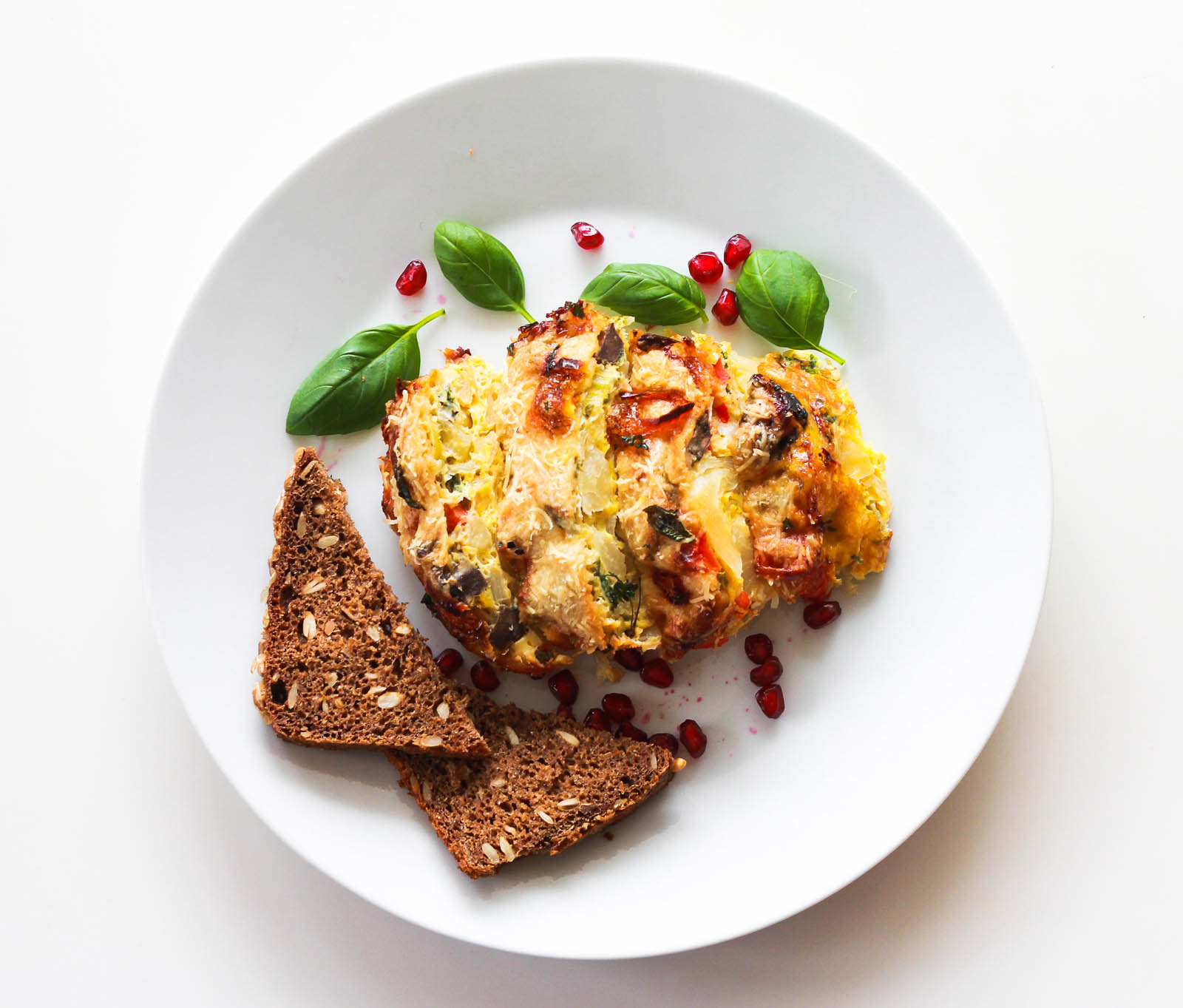 Super Easy Frittata Cavolo served in white round plate, top view
