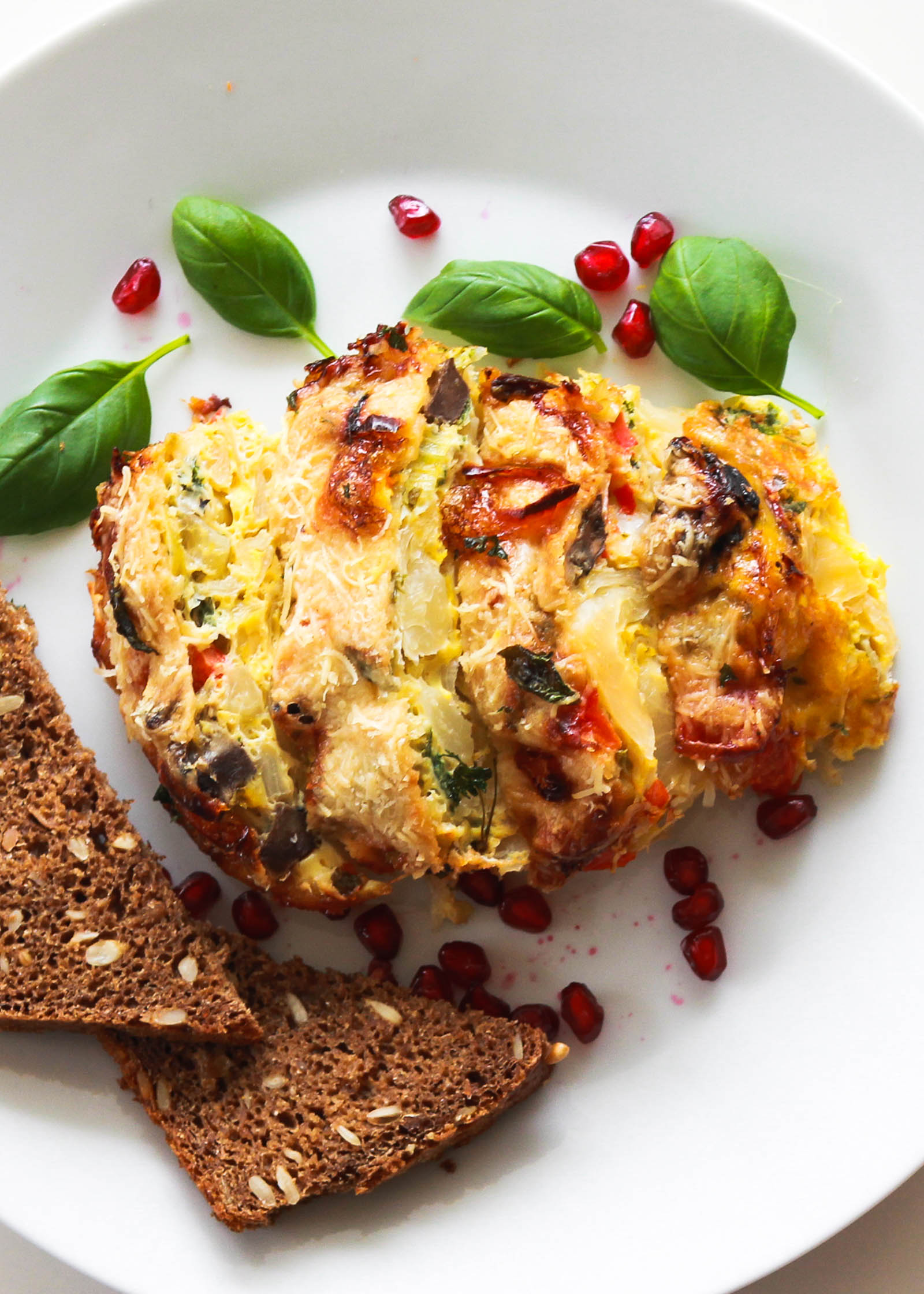 Super Easy Frittata Cavolo served in white round plate, top view close-up