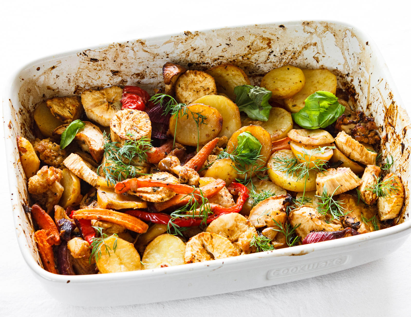 Big ceramic tray with freshly made oven roasted vegetables, perspective view