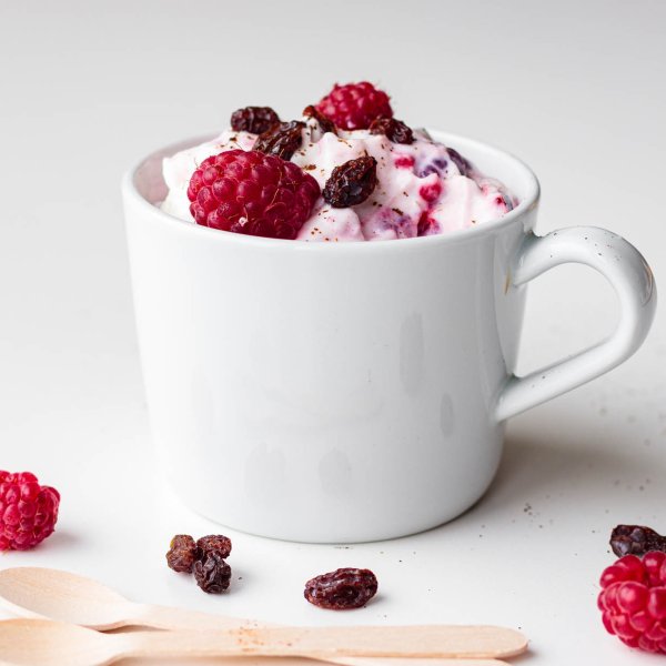 Delicious Norwegian Ice Cream decorated with raspberries and raisins