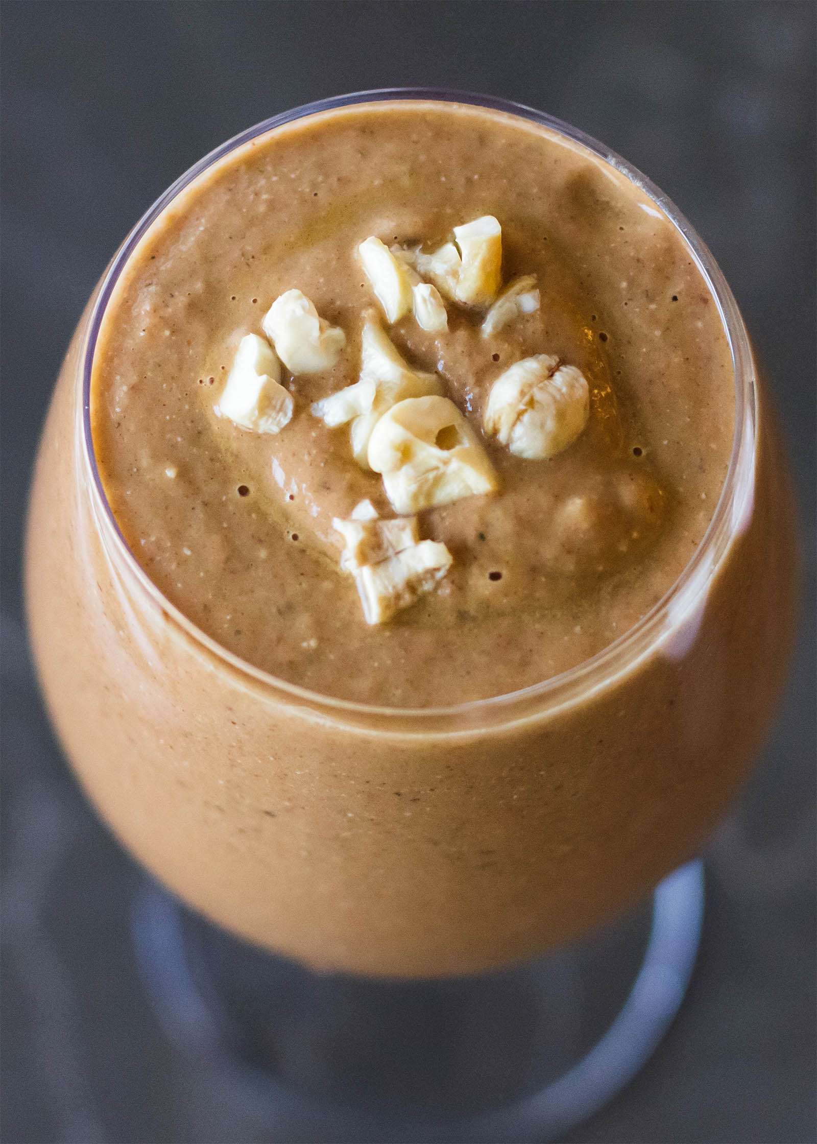 Top-down view with glass of Spices of India Smoothie on a table
