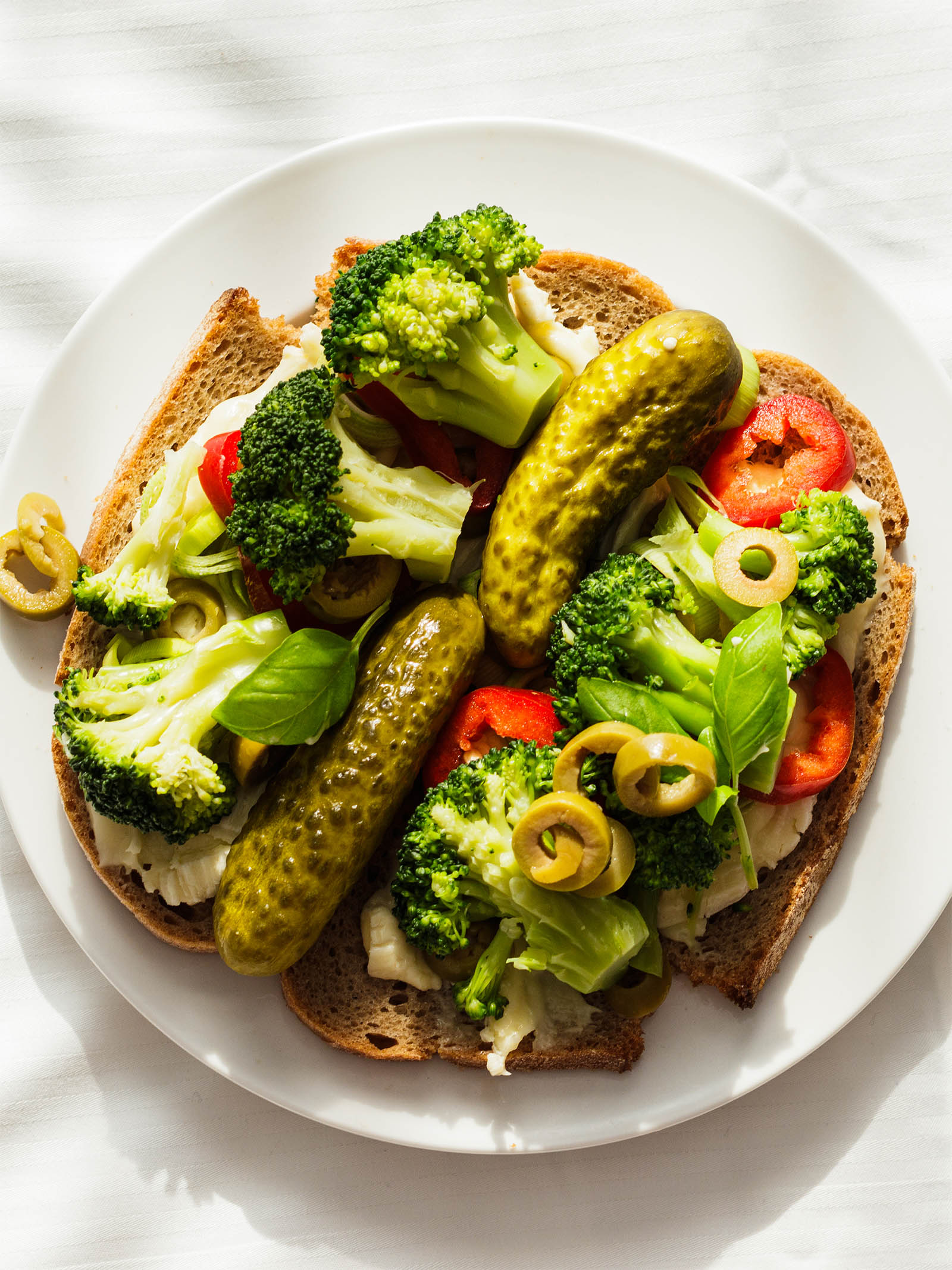 Vegetarian French Platter: La Brique and Vegetables ready to eat in white plate, top-down view